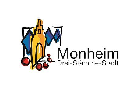Logo der Stadt Monheim mit stilisiertem gelben Gebäude auf der linken Seite, blauen Rauten hinter dem Gebäude und roten Kreisen darunter. Text: "Monheim Drei-Stämme-Stadt" rechts neben der Zeichnung des Gebäudes. Weißer Hintergrund